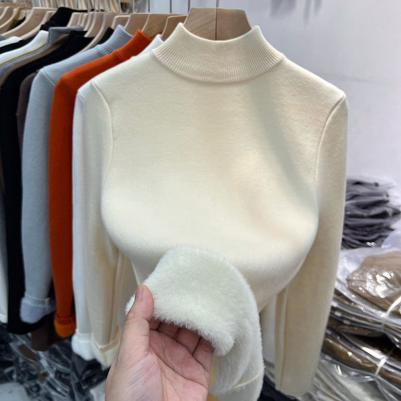 Suéter de cuello alto de lana gruesa para mujer.